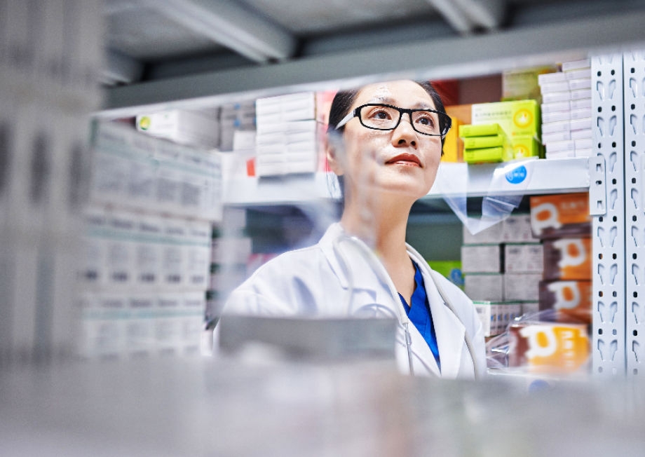 Image of a pharmacist in a stock room.