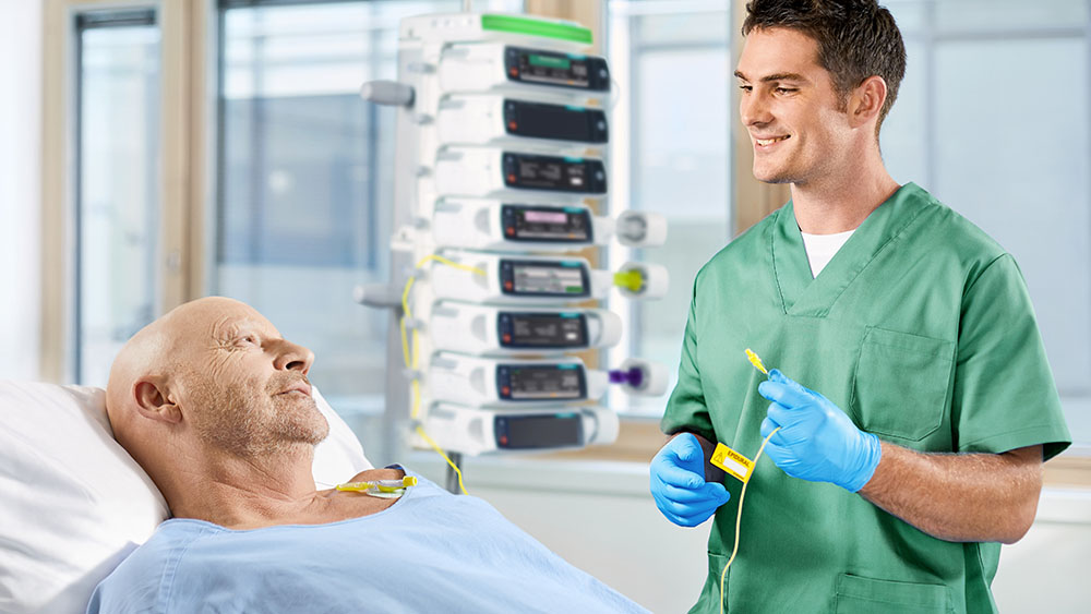 Nurse intuitively connects regional anesthesia line.