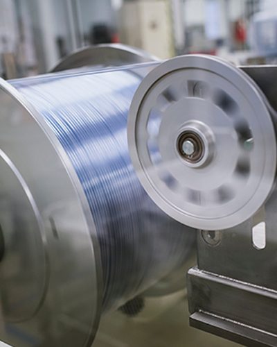 Close-up of an extrusion machine in progress. 