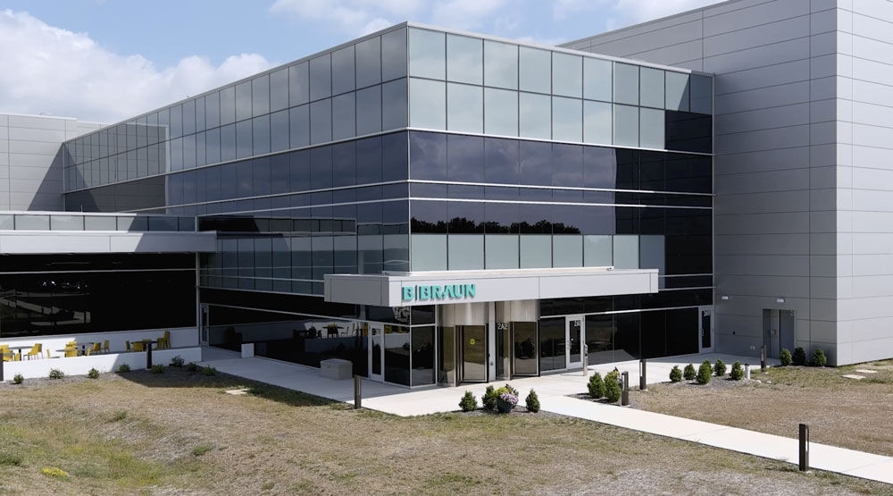 Exterior view of the B. Braun Allentown Manufacturing facility featuring a glass-front building and main entrance.