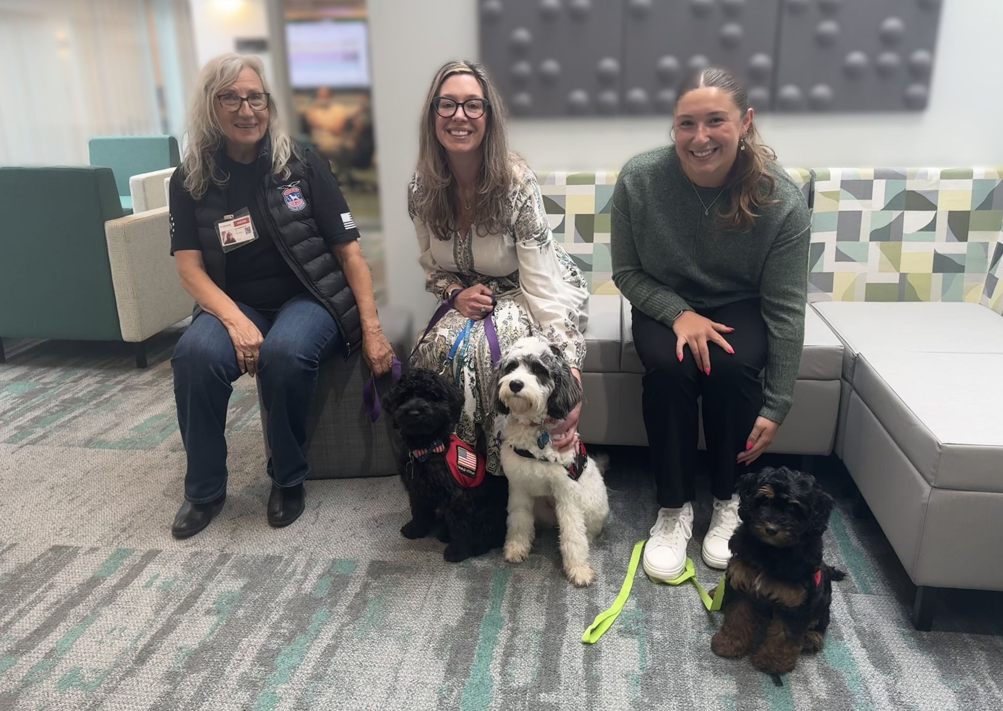 Tails of Valor representatives and service dogs in training visiting the B. Braun Bethlehem office.