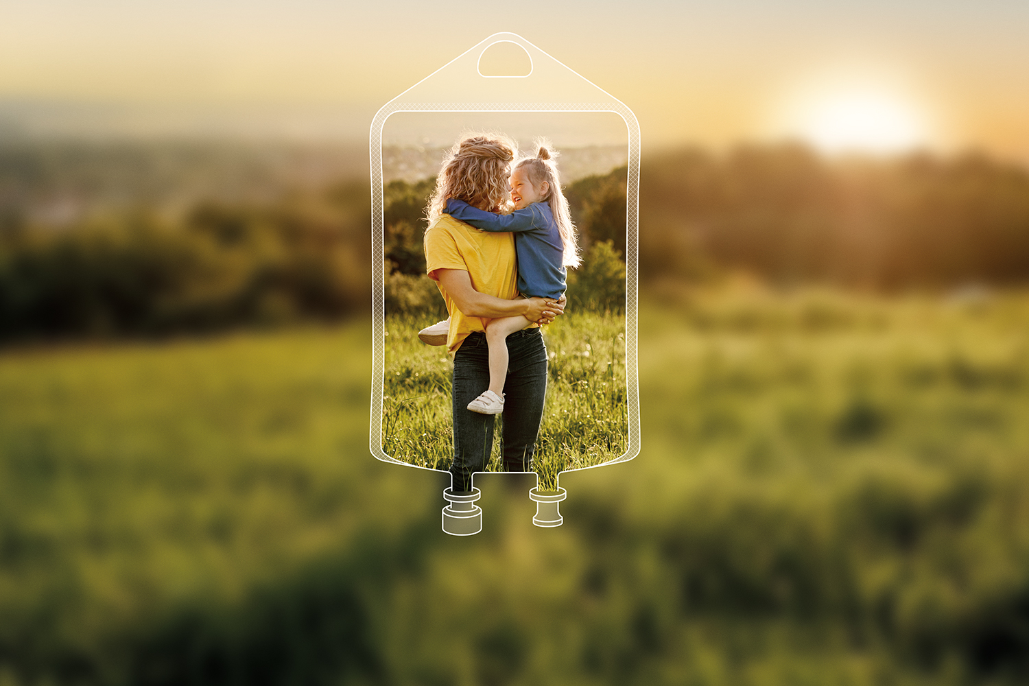 A clear image of a mother holding her smiling young daughter is framed by an illustrated IV bag, surrounded by a blurred background of a meadow of tall grass and the sun setting over the horizon.