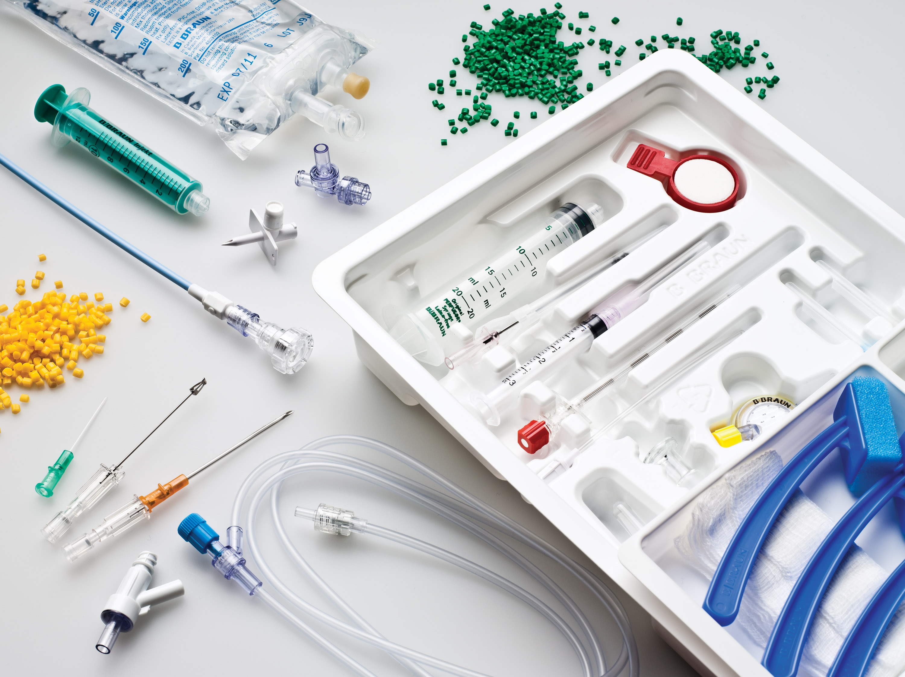 Medical devices in a kit and on a white background.