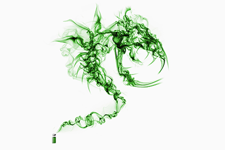 Green bottle with green vapor coming out from the top of it to form a large monster shape.