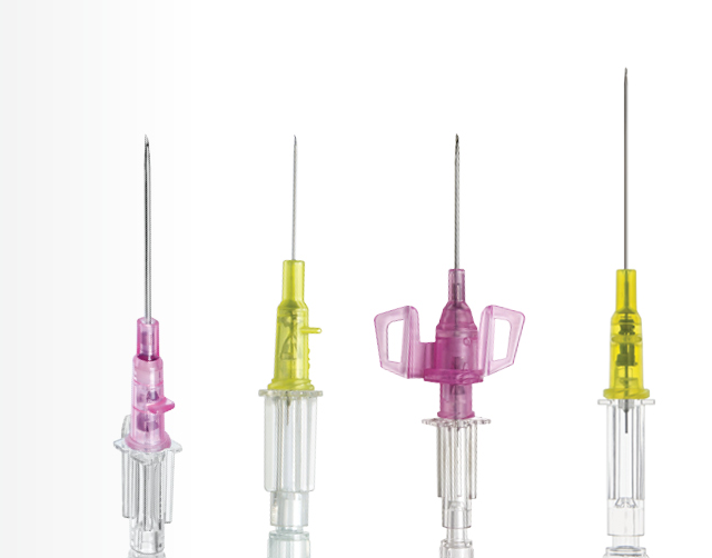 Four Introcan Safety IV Catheters on a white background. 